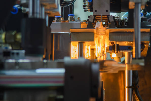 istock Conveyor belt deliver the preform shape to the  blow mold machine. 2189198897