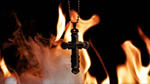 istock Christian Religion Symbol Cross on Fire 2189199375