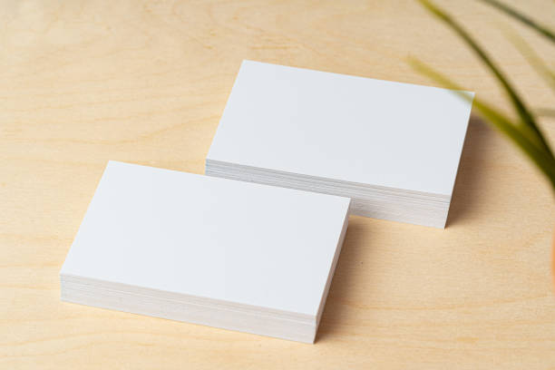 istock Two piles of blank business cards on table 2189200204