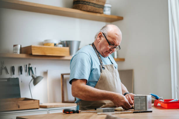 istock Senior carpenter working on furniture 2189203267