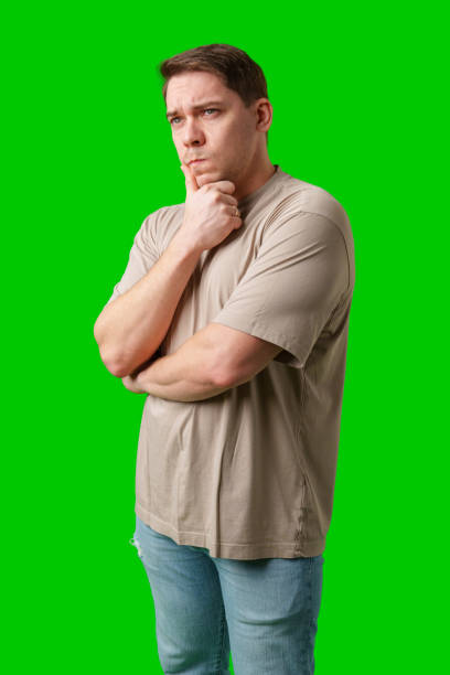 istock Thoughtful man gestures against a green background 2189203655