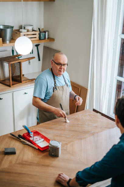 istock Senior carpenter working on furniture 2189203947