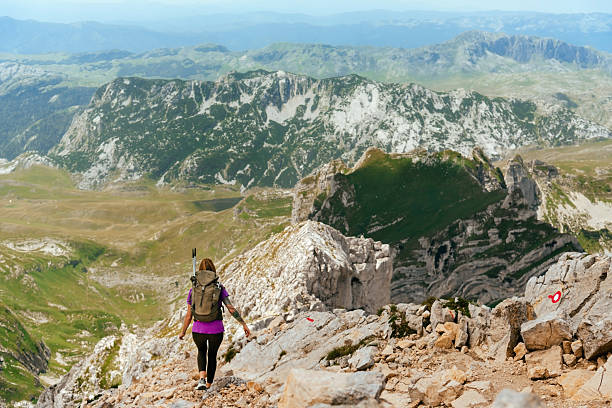 istock Female Hiker Walking Down Mountain Trail 2189204437