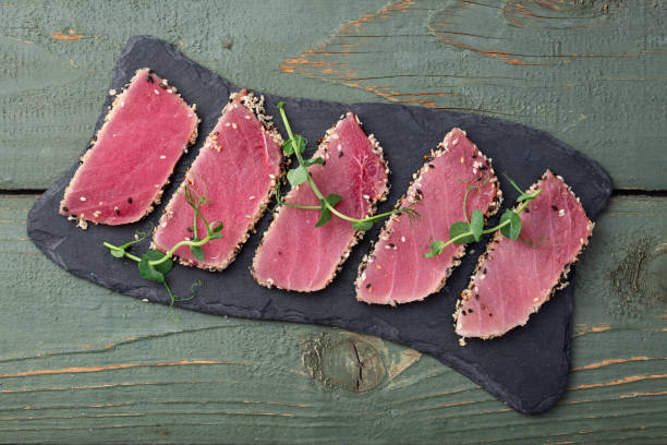 istock Sliced tuna steak with sesame photography . Top view 2189204467
