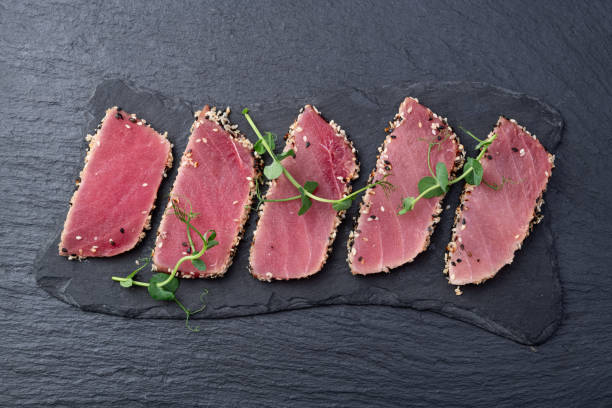 Sliced tuna steak with sesame photography . Top view