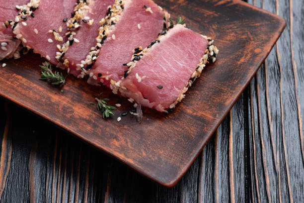 istock Sliced tuna steak with sesame photography . Top view 2189204482