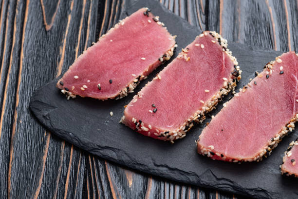 istock Sliced tuna steak with sesame photography . Top view 2189204483