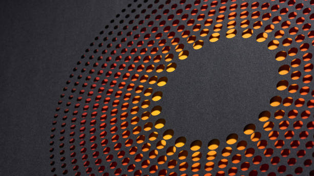 istock Circular perforated paper artwork with glowing orange and red gradient on dark textured background. 2189213738