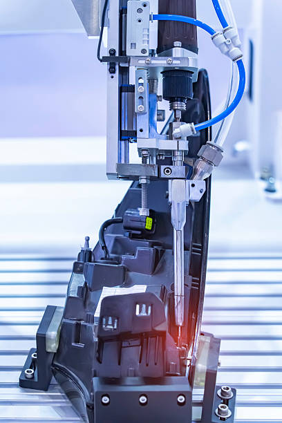 istock automatic robot drill machine tool at intelligence industrial manufacture headlight of a car factory 2189216376