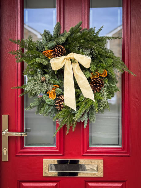 istock DIY Christmas Wreath on Red Door 2189220847