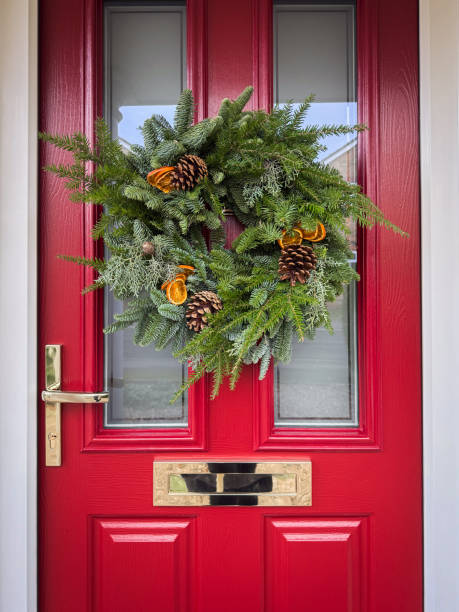istock DIY Christmas Wreath on Red Door 2189220890