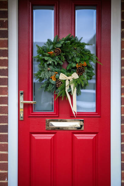 istock DIY Christmas Wreath on Red Door 2189220893