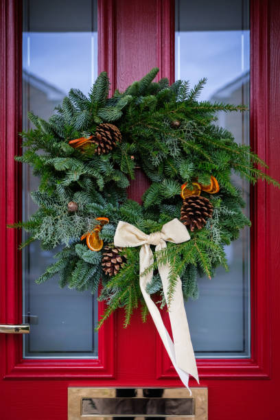 istock DIY Christmas Wreath on Red Door 2189220896