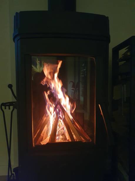 istock There is a fireplace in the room, a shelf with firewood next to it 2189222229