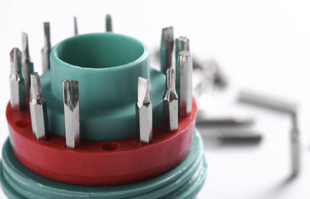Set of metal screwdriver bits on white background