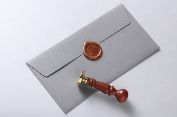 istock Envelope with wax seal and vintage stamp on gray background. Gift certificate, wedding invitation 2189222799