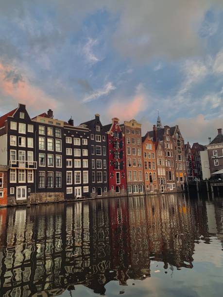 istock Quaint Amsterdam Canal with Reflections of Dutch Charm 2189223074