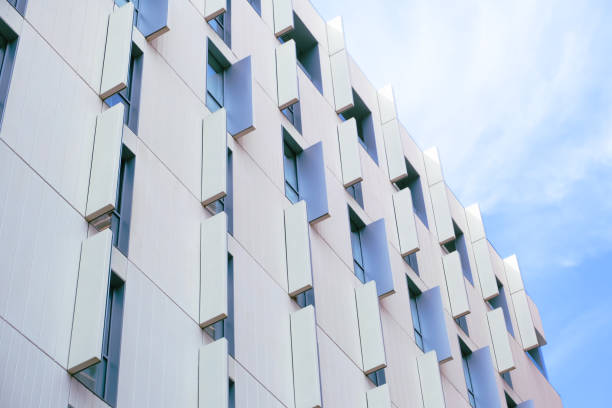 istock modern building facade design showcasing geometric panels and vertical windows under a clear sky 2189224528