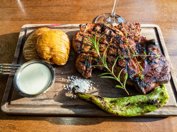 istock cooked grilled t-bone beef steak on wooden board 2189227066