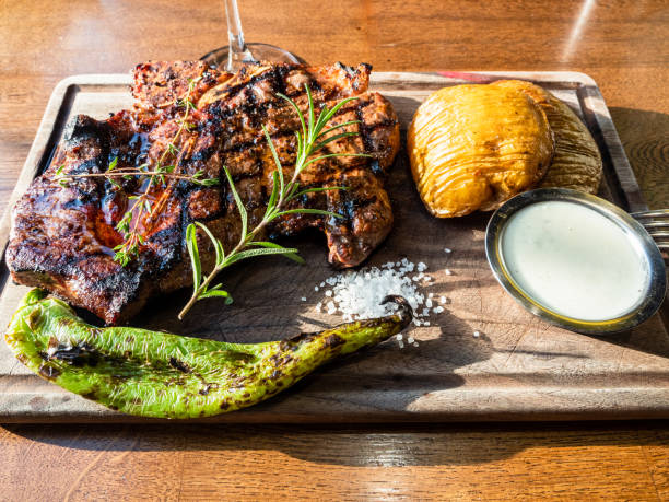 istock grilled t-bone beef steak on wooden cutting board 2189227070