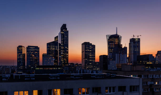 istock Urban sunset illuminating a modern city skyline 2189228117