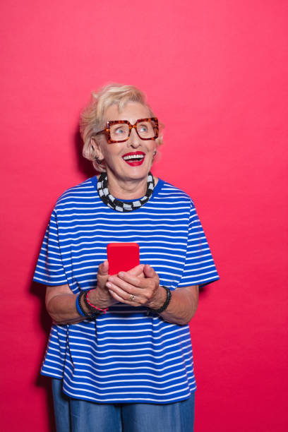 istock Portrait of surprised cool senior lady using mobile phone 2189228137