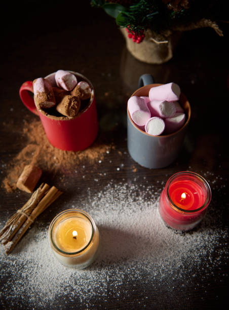 istock Cozy winter scene with hot cocoa and marshmallows on a rustic table 2189230770