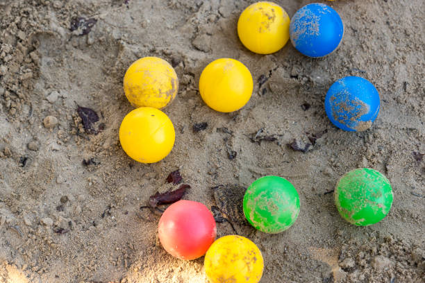 Colorful children's toys in a sandbox