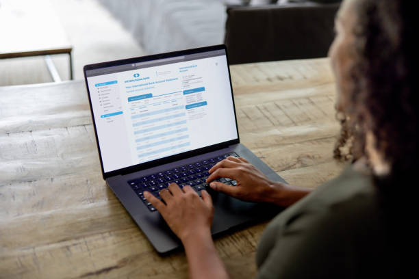 istock Woman at home checking her bank statement using a laptop 2189234813