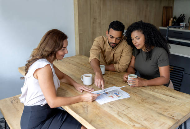 istock Couple talking to a financial advisor about their home finances 2189234818
