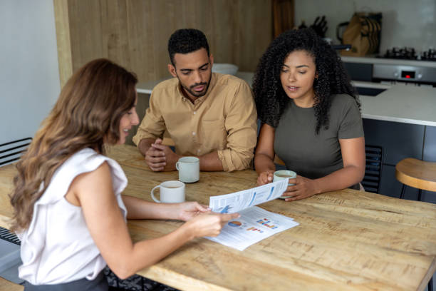 istock Financial advisor helping a couple with their home finances 2189234821