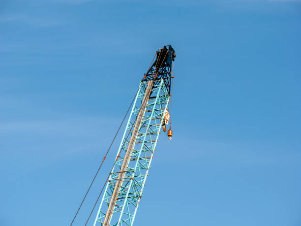 A crane is being operated at the construction site.