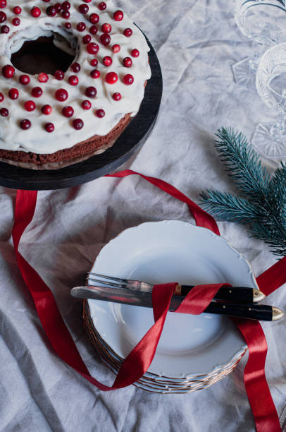 Delicious ready to eat wreath Christmas cake decorated with fresh cranberries and cream cheese frosting with festive styling