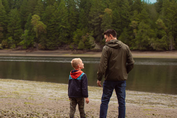 istock Father and son having a good time at the beach. 2189246009