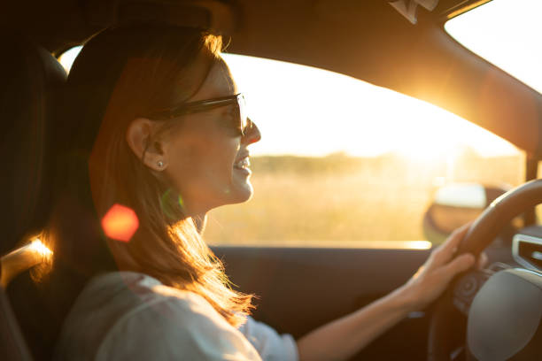 istock Woman driving through a country side in Europe. 2189246710