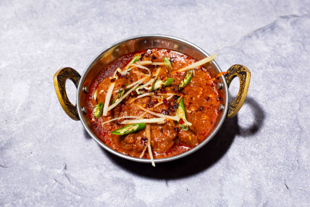 istock Mutton Karahi topped with ginger and green chilli served in karahi isolated on grey background side view of indian, bangladeshi and pakistani food 2189246984