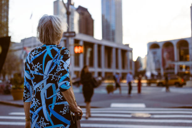 City Life: Senior Woman Waiting at Crosswalk
