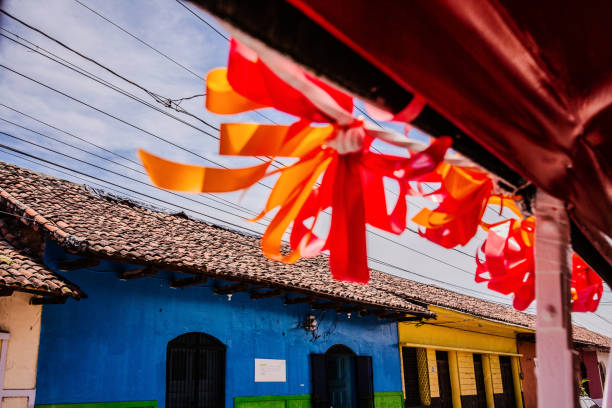 Ribbons fly in front of buildings in Nicaragua (Granada)