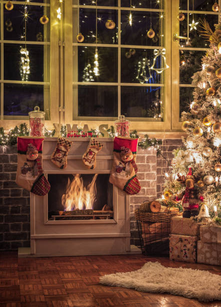 Holiday season fireplace. Warm, cozy, glowing Christmas holiday season scene, with blazing fire in fireplace.
