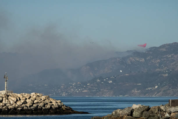 Malibu, CA , USA - December 10, 2024: Franklin Fire in Malibu broke out around 11pm on Monday, December 9th. The fire spread by 1am prompting warnings and evacuations near Pepperdine University. Fire viewed from Marina del Rey, CA.