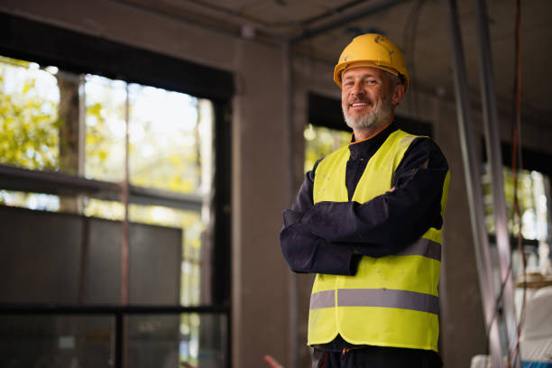 istock Confident Construction Worker in Safety Gear at Building Site 2189260211