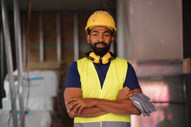 istock Confident Construction Worker With Hard Hat and Safety Vest On Site 2189260217