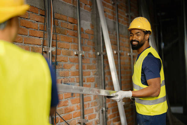 istock Smiling Construction Workers Wearing Safety Gear In Indoor Site 2189260246