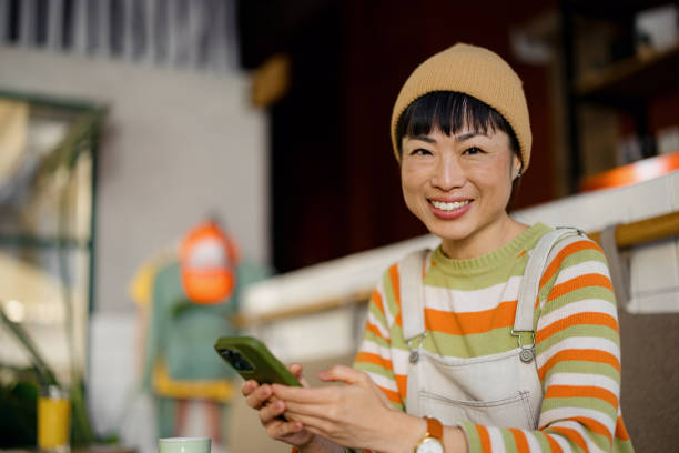istock WomanEnjoys Coffee Break While Working at a Cozy Cafe 2189267012