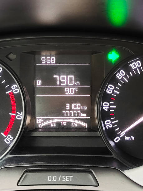 Digital modern LCD display of a car with a dashboard with backlight, speedometer, tachometer, fuel gauge and other indicators close-up