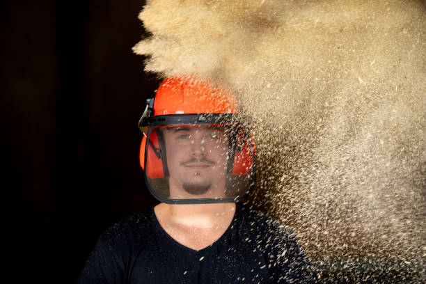 Carpenter portrait behind wood shavings