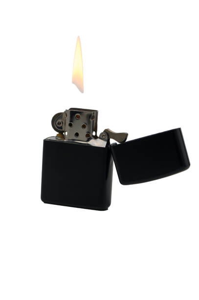 istock Sleek black lighter with flame illuminating dark surroundings at night in a cozy gathering 2189269357