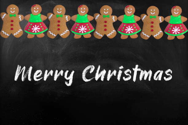 Christmas card with gingerbread cookies on blackboard
