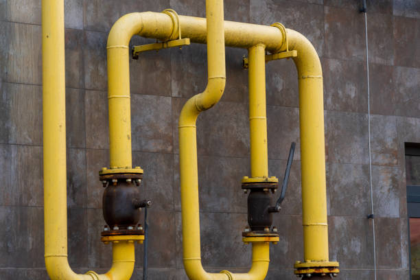 istock Intricate network of yellow pipelines showcases energy transportation technologies. This industrial setup features metal tubes connecting to valves, emphasizing efficiency in powering infrastructure 2189270308