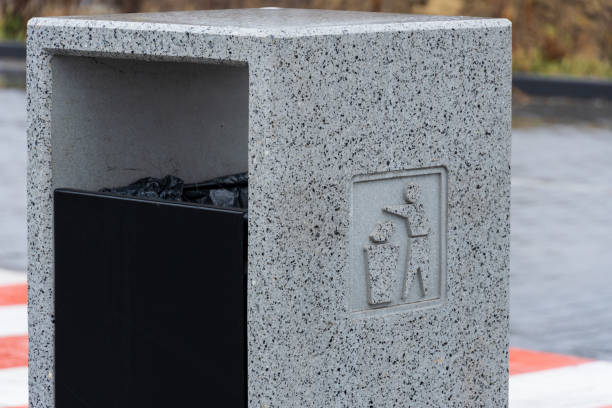 istock A modern grey garbage container stands in an urban area, inviting passersby to dispose of their trash responsibly. The design promotes recycling and environmental awareness through simple signage 2189270380